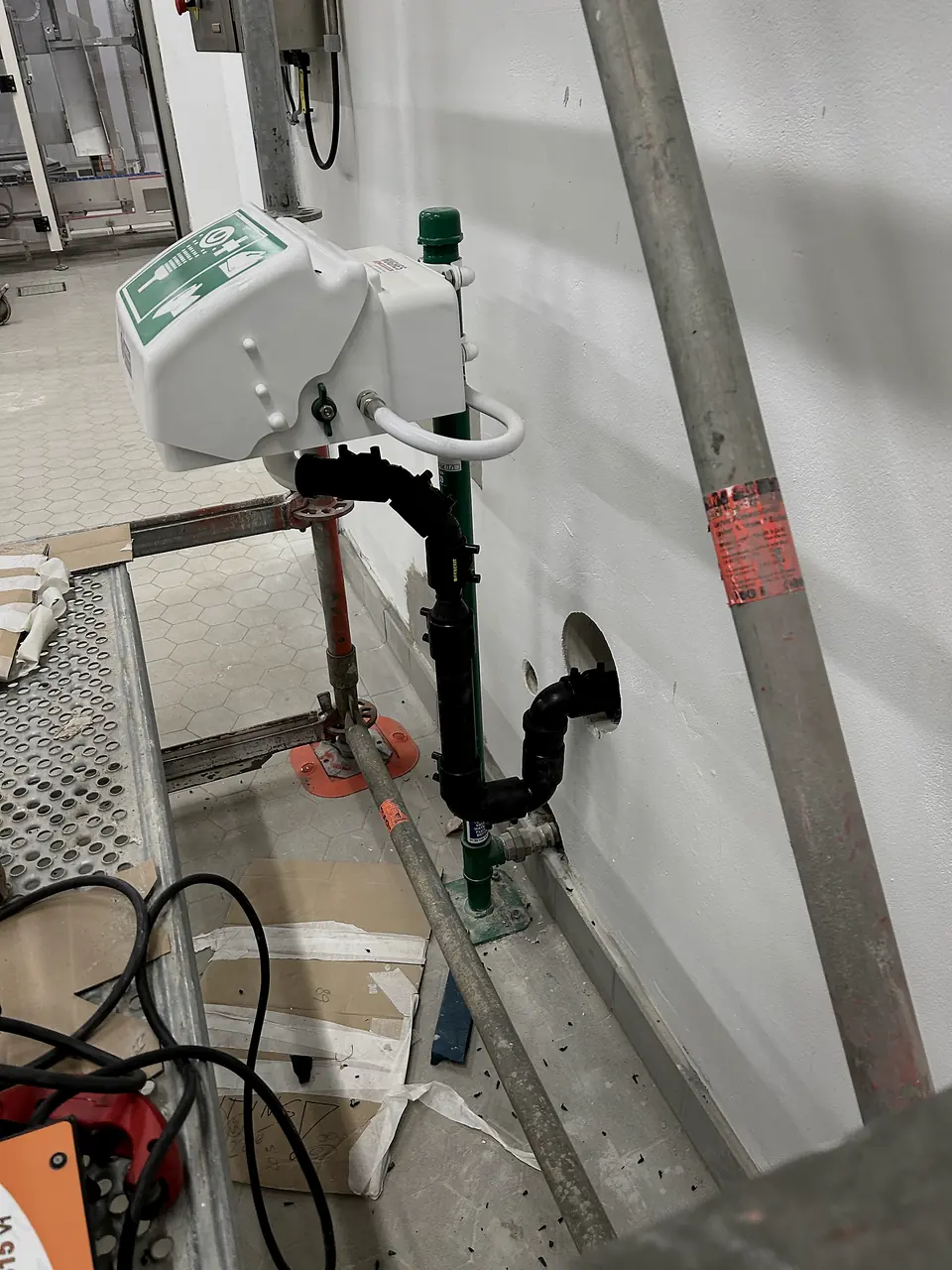 PE pipe installation by a wall with measuring instruments