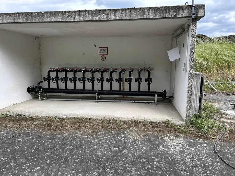 PE pipe manifold in a covered enclosure