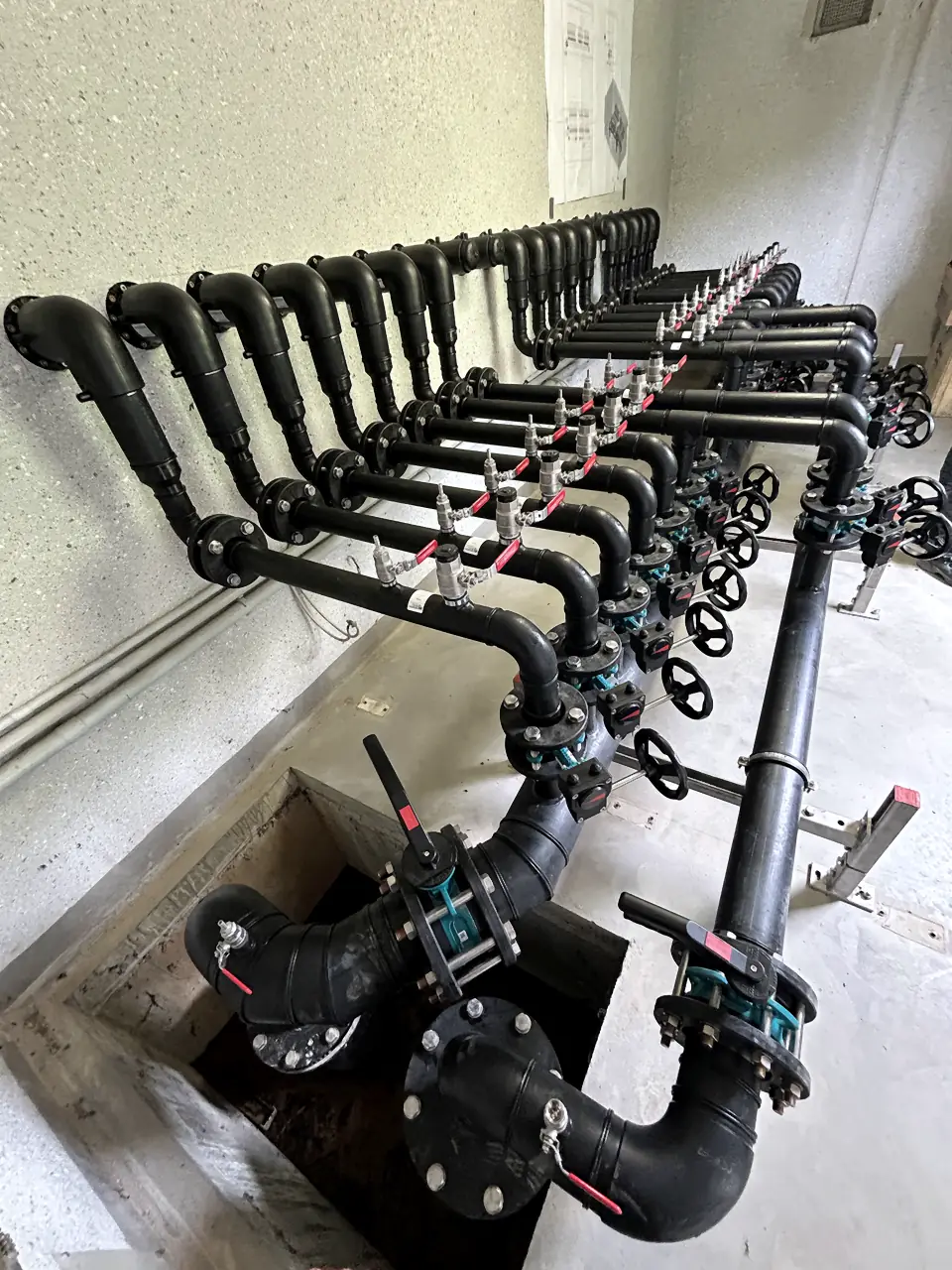 PE pipe manifold leading into an inspection chamber